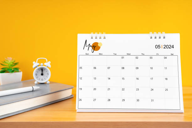 May desk calendar for 2024 year on work table with yellow.