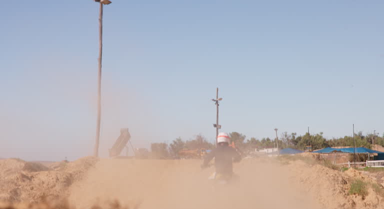 Bike, sand and speed with man off road for action, competition or performance on dirt track. Motorcycle, sports and summer with rider on race course for adventure, adrenaline or challenge at training