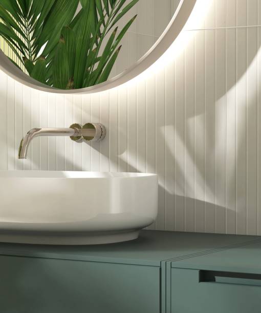istock Modern white washbasin on dark green vanity counter countertop in sunlight on cream tile wall bathroom 2149195601