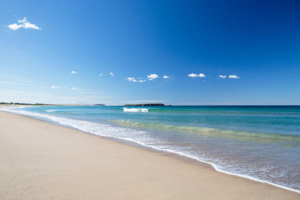 istock Beautiful blue ocean shoreline with island under blue sky 2149196046