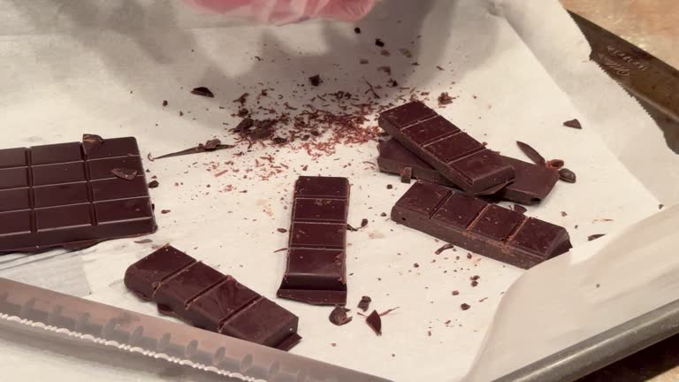 Scoring And Breaking Apart Homemade Keto Friendly Dark Chocolate Squares