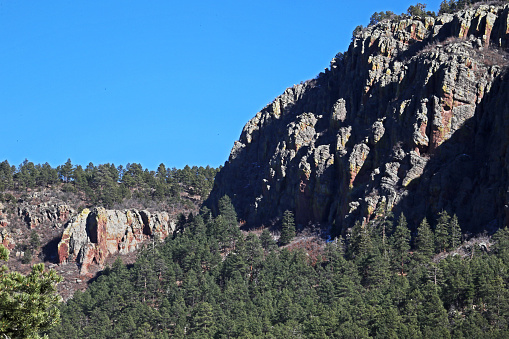 The high cliffs at Water Canyon  of the Magdalena Mountains as seen from Water Canyon Campground of the Cibola National Forest.