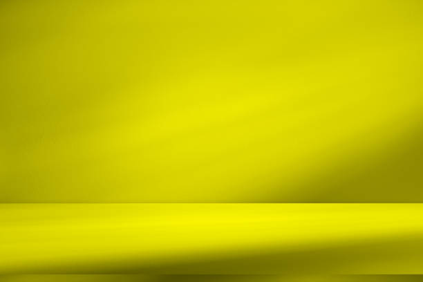 istock Wall interior background, studio and backdrops show products.with shadow from window color yellow . background for text insertion and presentation product 2149198977