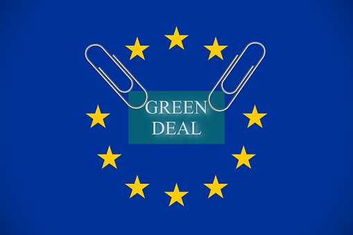 Flag of European union with the words Green deal - environmental and ecological policy of climate neutrality. Vector illustration