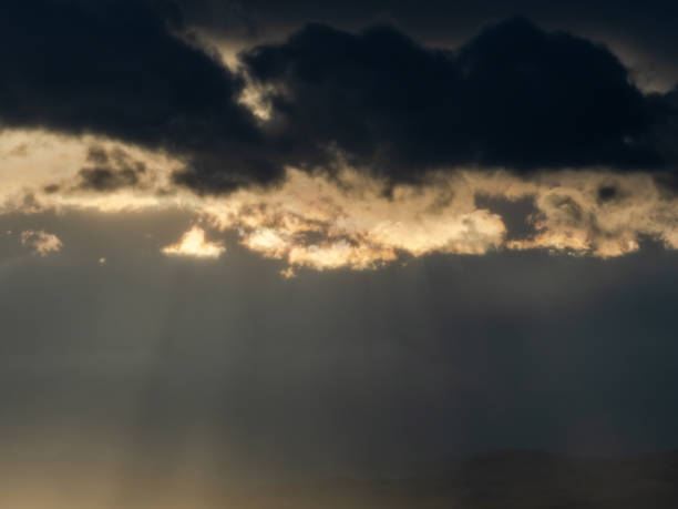 istock Ray lights dramatic sky sun disappear end day sunset evening orange 2149203237