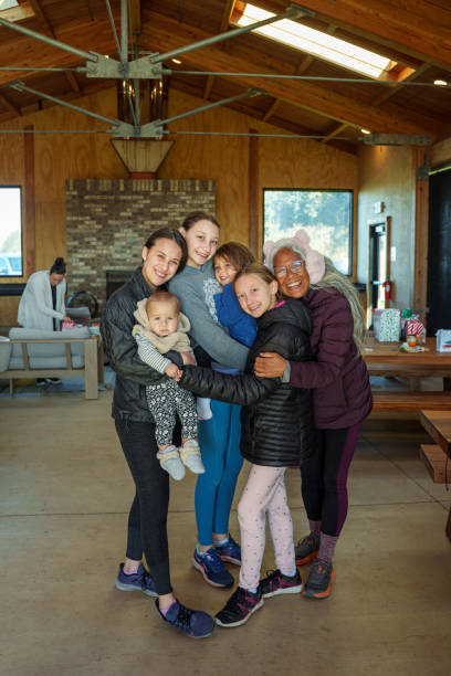 istock Proud and loving grandmother posing with her granddaughters 2149203485