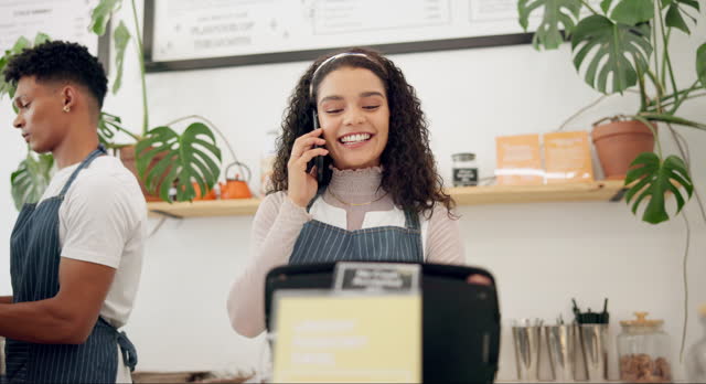 Woman, cafe and barista with phone call order for ecommerce, takeaway and communication at counter. Person, small business and waiter with technology for discussion, service and digital sale