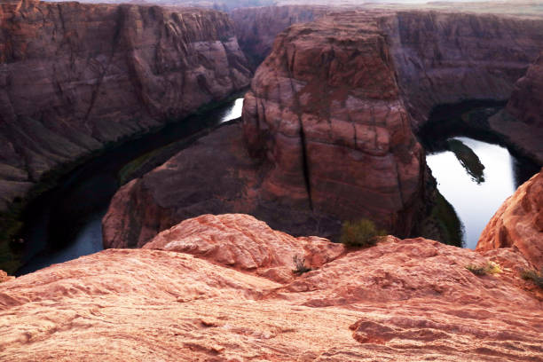 Horseshoe Bend, canyon and Colorado river at sunset