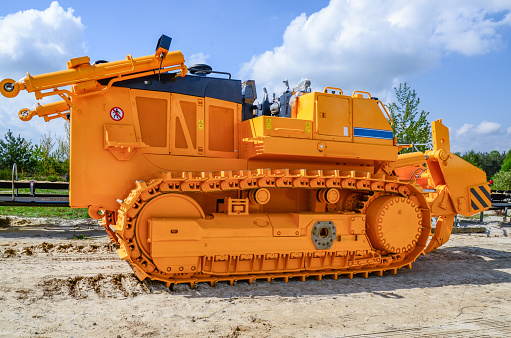 Brand new crawler dozer weighing 70 tons without operator's cabin and dozer blade. Heavy industry. Construction equipment.