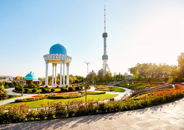 Tashkent Television TV Tower in Uzbekistan The Tashkent Television TV Tower Toshkent Teleminorasi and memorial column with round roof in the park at sunset in Uzbekistan tashkent stock pictures, royalty-free photos & images
