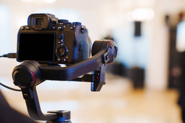 istock A professional camera on the blurred background of a banquet hall. 2149208351