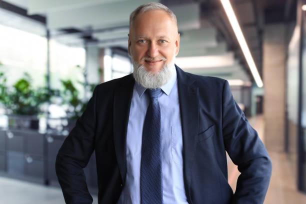 istock Businessman with colleagues in the background in office. 2149208548