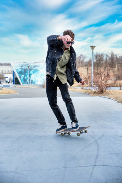 istock Young man riding a skateboard making tricks and jumps 2149209476