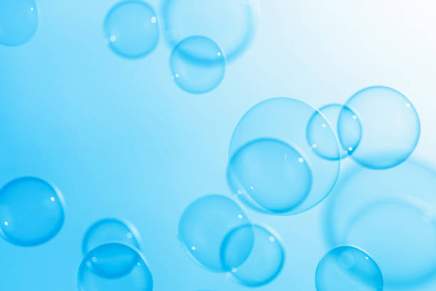 istock Beautiful Blue Soap Bubbles Floating in The Air. Celebration Festive Backdrop. Freshness Soap Suds Bubbles Water. Abstract Blue Textured Background. 2149209791