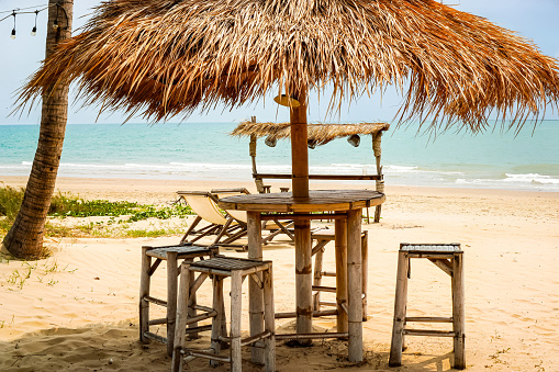 Bamboo and Thatched roofs are often used to create shelters or outdoor dining tables that provide a cool, breezy atmosphere, especially on beaches by the sea.