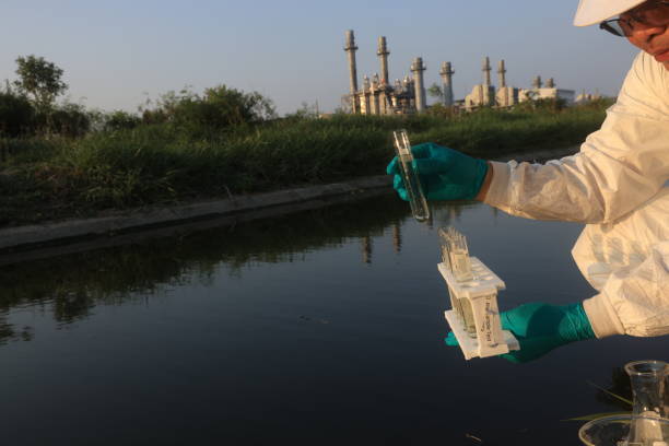 istock Environment Scientist examining water and collecting water samples 2149209867