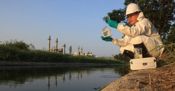 istock Environment engineers sample and test toxic wastewater from factories, environment control in the industrial estate 2149209868