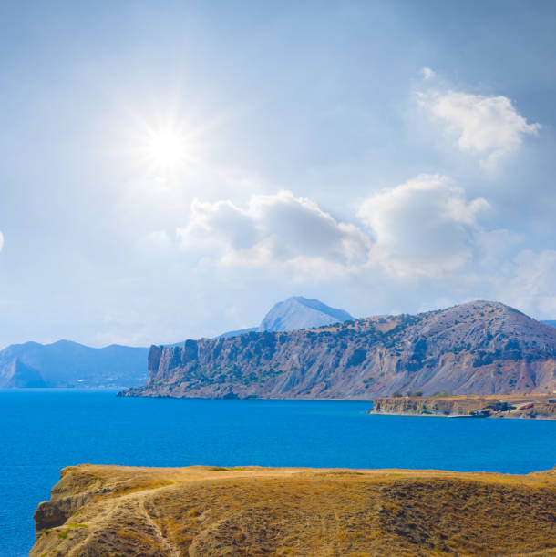 istock rocky sea coast  at bright summer sunny day 2149213086