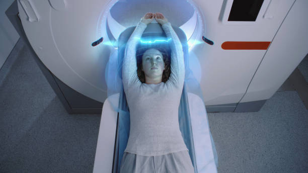 istock Female patient undergoes MRI or CT scan. Visual effects of scanning 2149213305