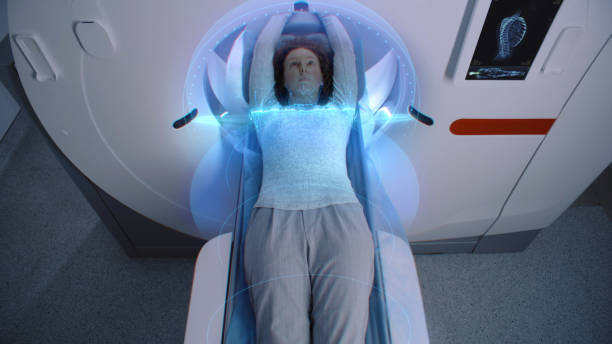 istock Female patient undergoes MRI or CT scan. Visual effects of scanning 2149213344