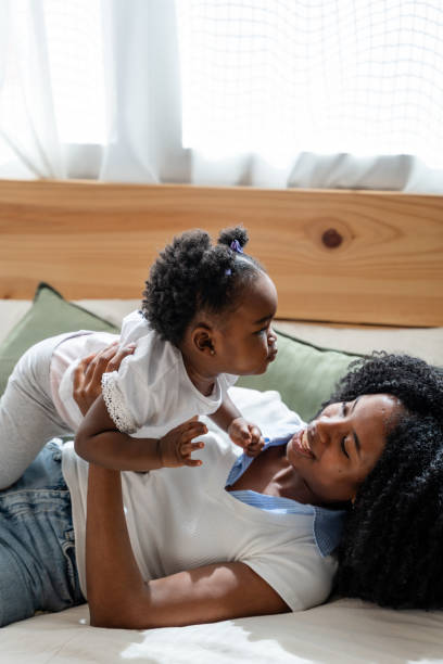 istock Tender mother-daughter moment on bed 2149213498