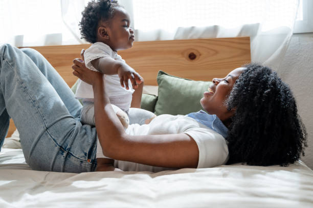 istock Joyful mother and baby bonding time at home 2149213517