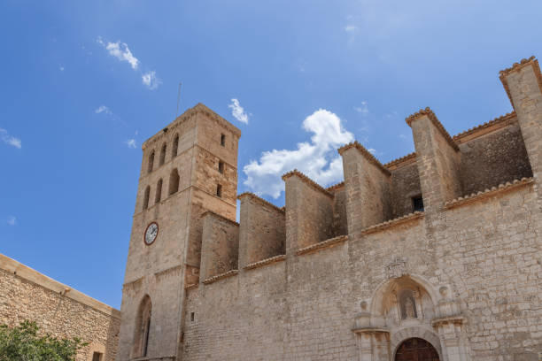 Ibiza - Spain. July 25, 2023: Facade of Almudaina Castle in Eivissa old town, Ibiza, stands under a clear sky, its medieval architecture a testament to the island rich history