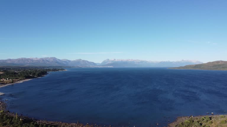 Lake Nahuel Huapi with Bariloche Argentina and snow-capped mountains behind the lake