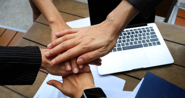 istock Teamwork Concept,Group of diversity people to greeting power tag team,Teamwork Join Hands Partnership Concept of people putting their hands together,Friends with hands showing unity. 2149216721