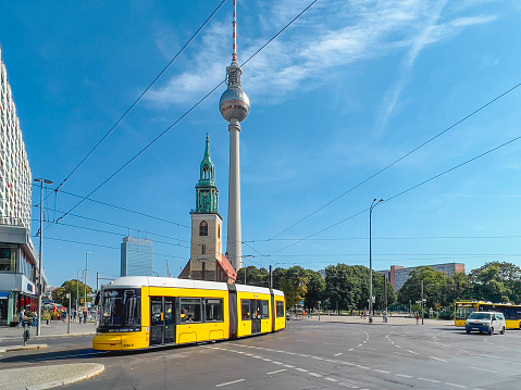 Intersection of Karl-Liebknecht with Spandauer Straße with tram and TV tower in Central Berlin Germany