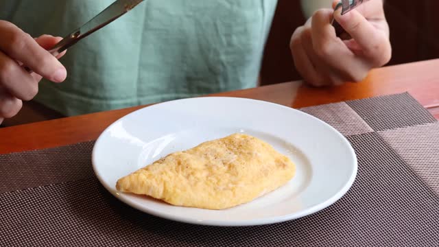 Slicing and Serving a Golden Omelette