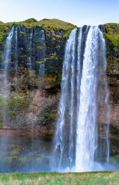istock A waterfall with a green mossy rock wall behind it 2149218813