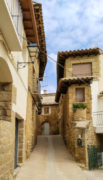 istock A narrow alleyway with rustic houses on either side 2149218873
