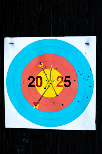 Target board with arrows on black background