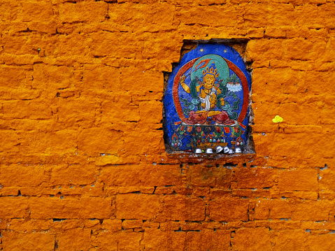 small Buddha painting on the wall niche of  Potala Palace, Lhasa, Tibet Autonomous Region, China.