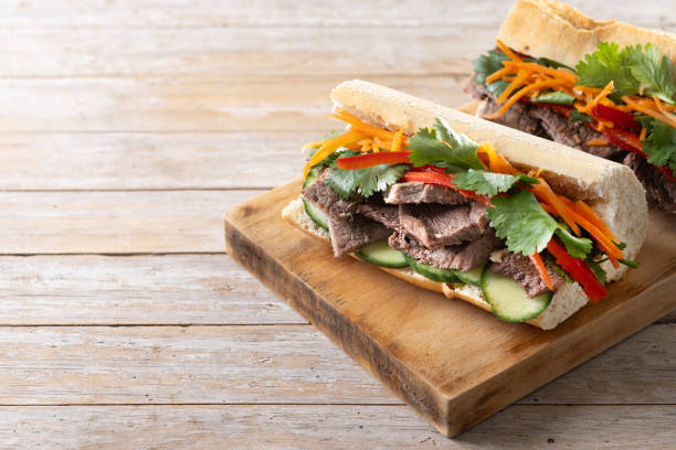 istock Vietnamese banh mi sandwich on wooden table 2149220596