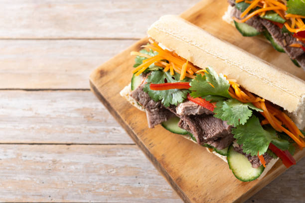 istock Vietnamese banh mi sandwich on wooden table 2149220622