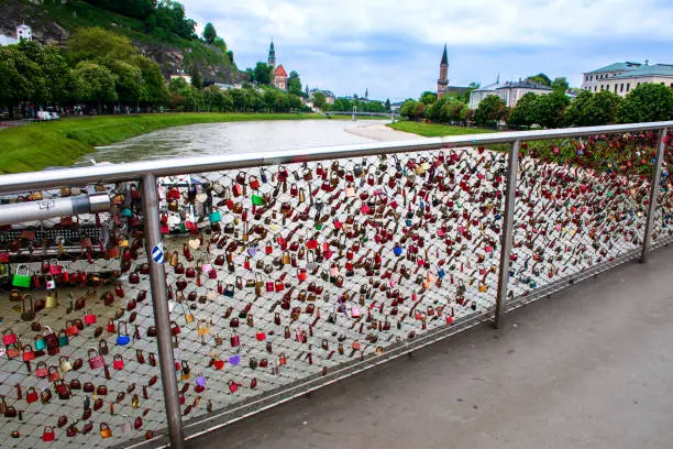 Love lock bridge over Salzach river a symbol-of eternal love Salzburg of Austria