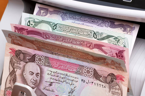 istock Old Afghan Afghani in a counting machine 2149220917