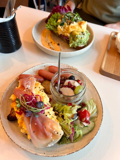 istock Breakfast Restaurant served Scrambled Eggs with Proscuitto on Toast Bread and Avocado Mash Guacamole. 2149220962