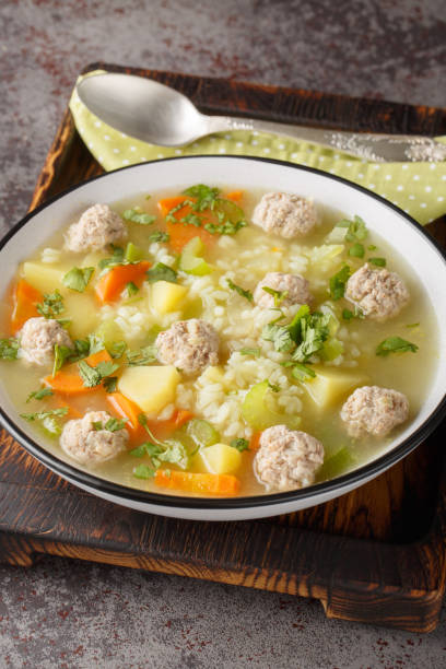istock Rice soup with meatballs and vegetables close-up in a bowl. Vertical 2149222422