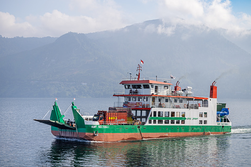 Lake Toba, North Sumatra, Indonesia - February 2nd 2024:  Ferry bringing cars and trucks to the Samosir Island