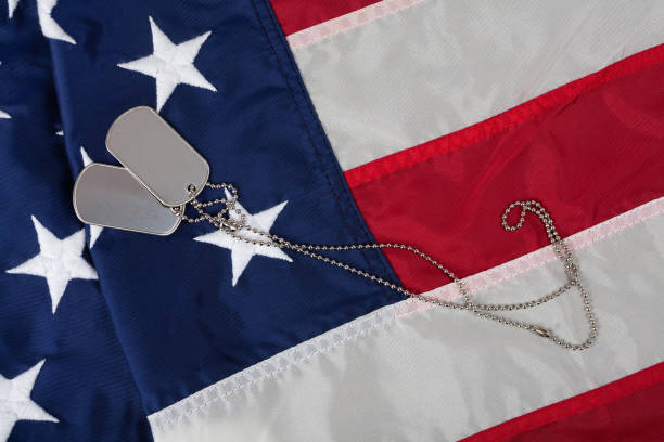 US army dog tags on USA national flag
