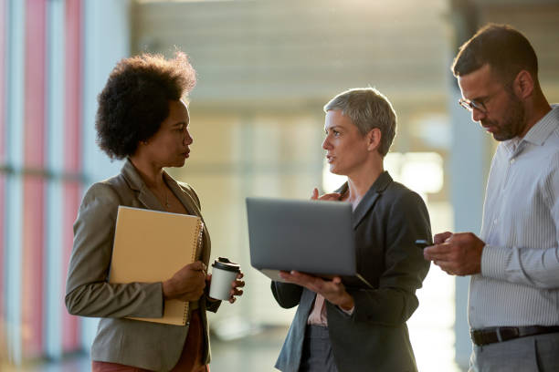 istock Team of entrepreneurs working in a hallway. 2149225205