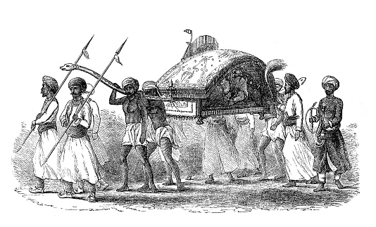 India - men carrying a person in a palanquin