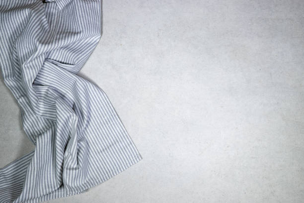 gray linen checkered cloth kitchen napkin. tablecloth on grunge background, top view, design element