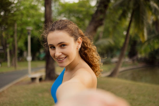 istock Happy sportswoman taking a selfie during spring day in the park. 2149230023