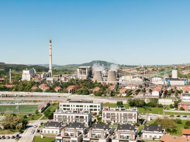 istock Large factory by a residential area 2149230136