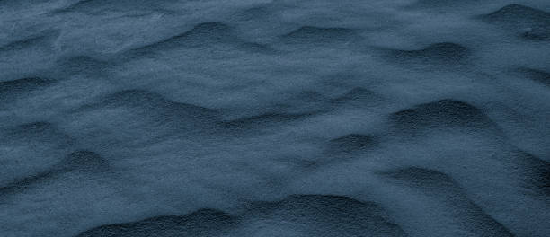 istock blue desert sand shaped into waves by the wind 2149230680