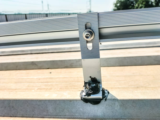 istock Installing a roof mounting kit for installing solar panels 2149231211